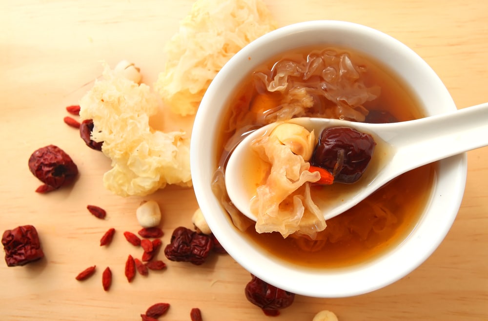 Chinese Traditional White Fungus Or Snow Fungus Soup Over Wooden background