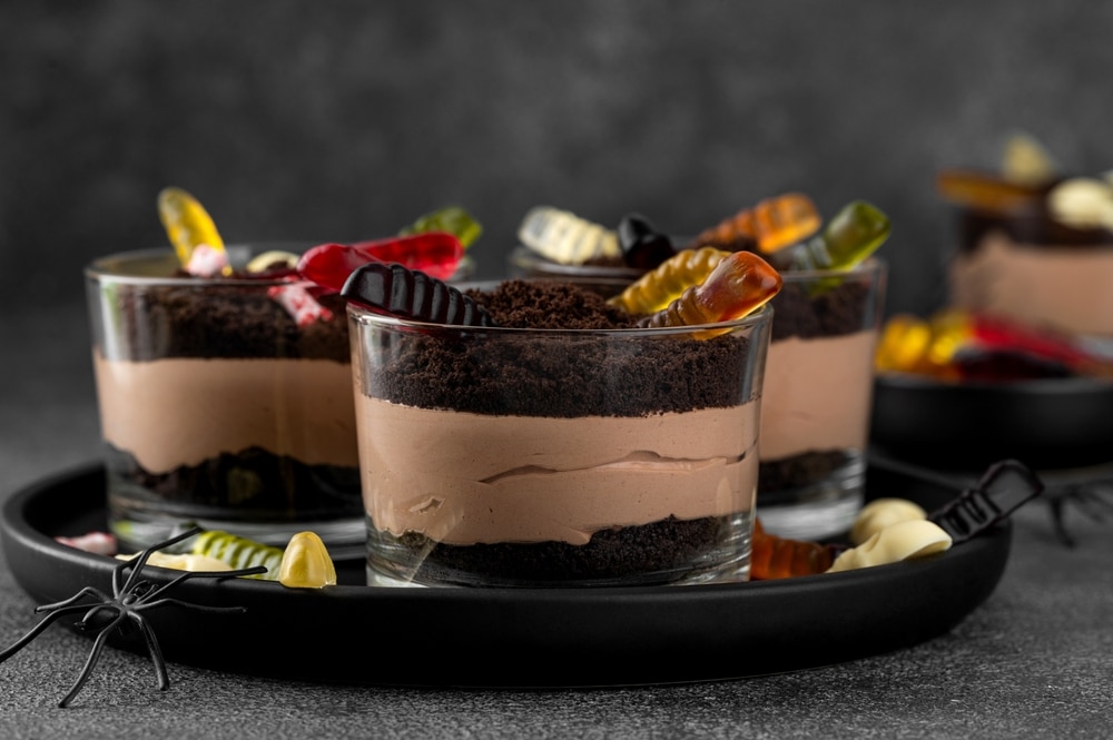 Halloween Chocolate Dirt Cups With Gummy Worms On A Dark