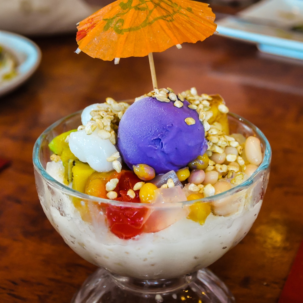 Philippine 'Halo Halo' Dessert consisting of shaved ice and milk along with various ingredients including boiled sweet beans coconut sago gulaman (agar jelly) tubers and fruits