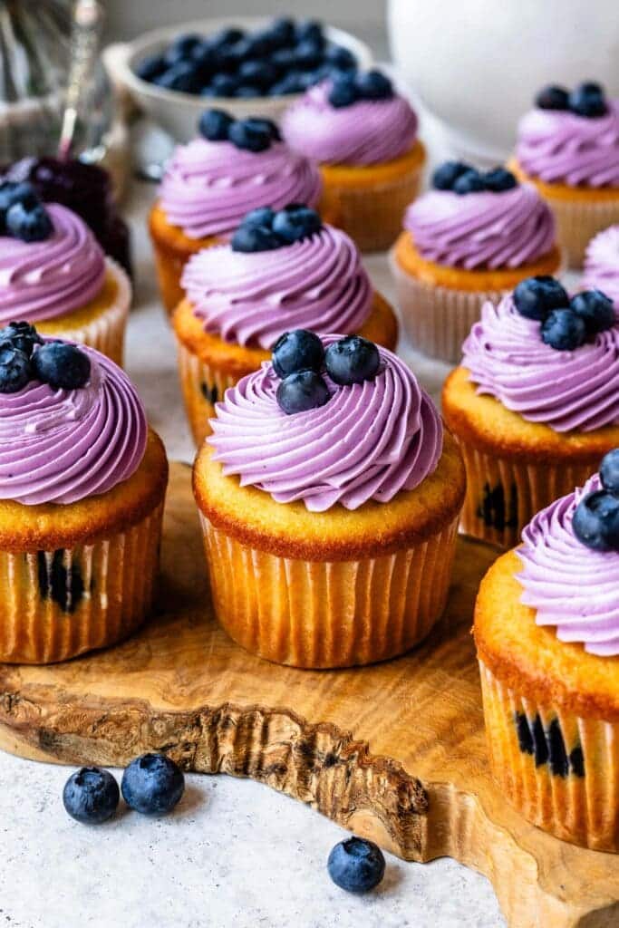 Blueberry Muffins with Blueberry Icing topped with fresh blueberries