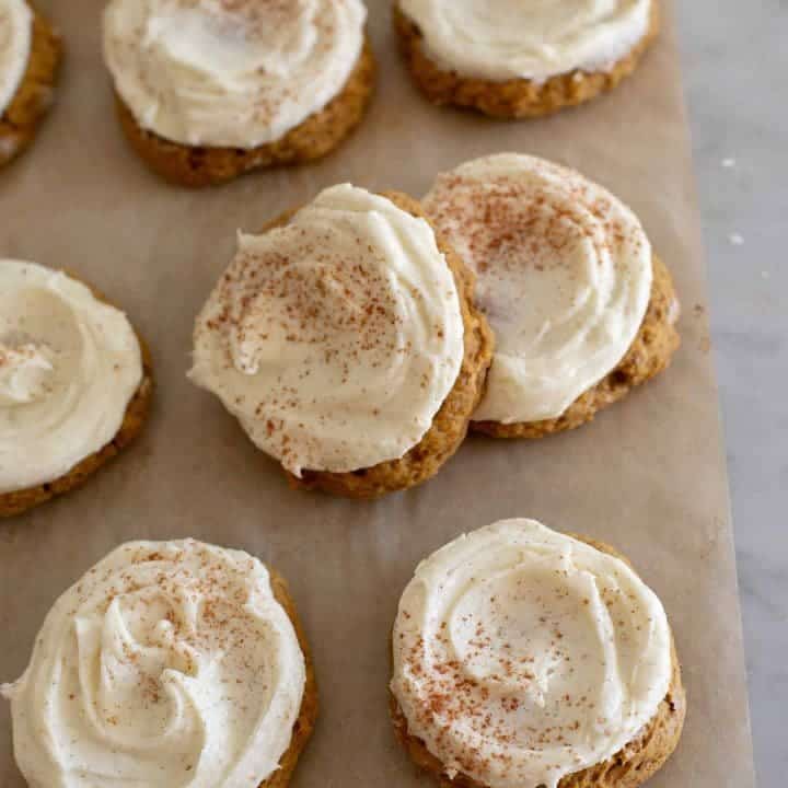 Cookies topped with cream and pumpkin spice