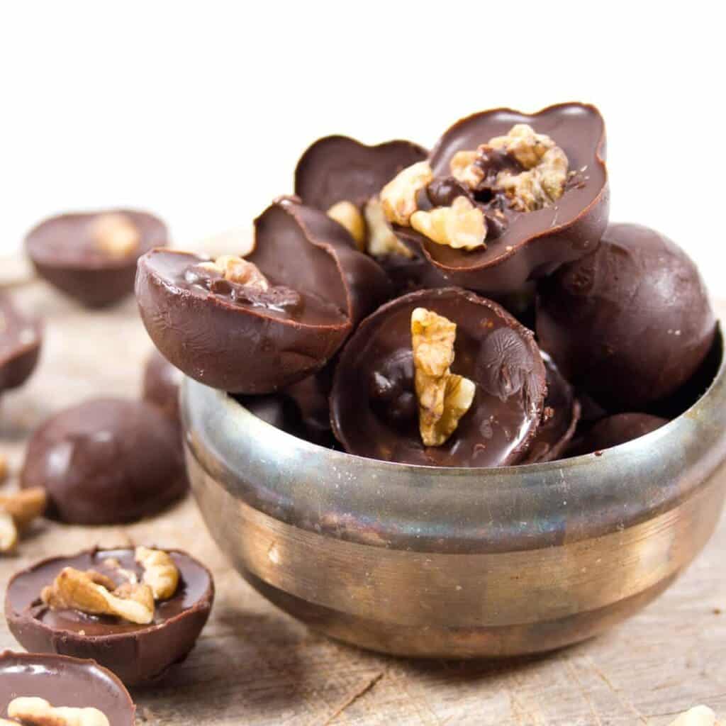 a bowl of chocolate walnut keto fat bombs