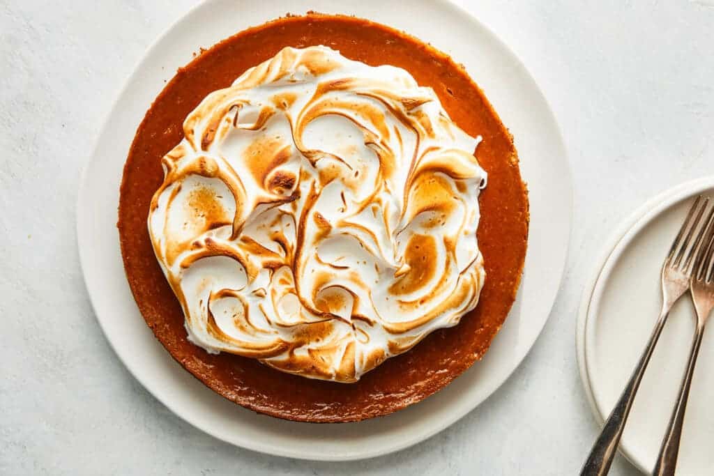 A top view of a pumpkin meringue pie