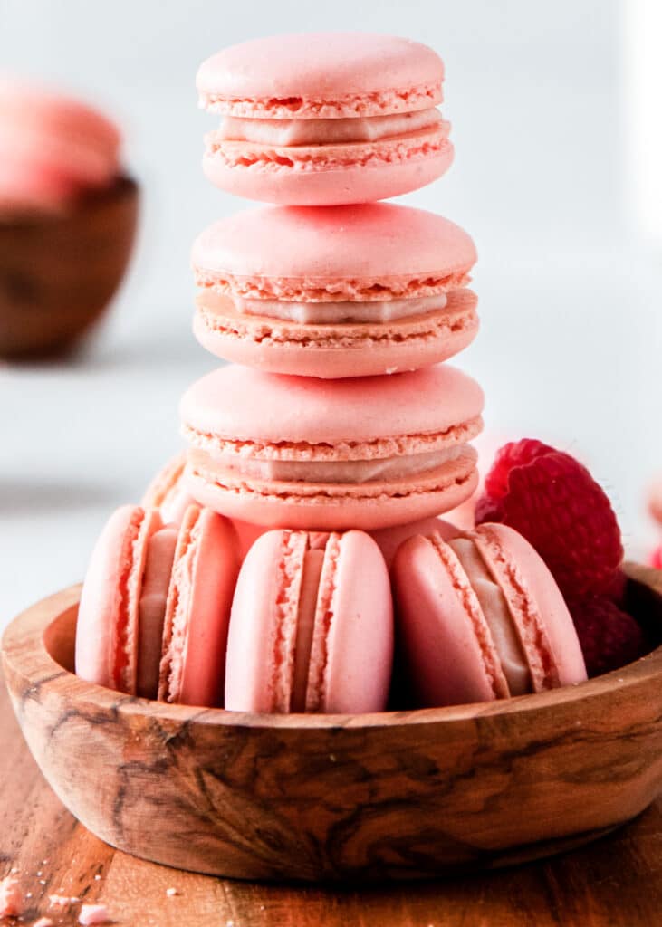 A view of pink raspberry macarons piled up