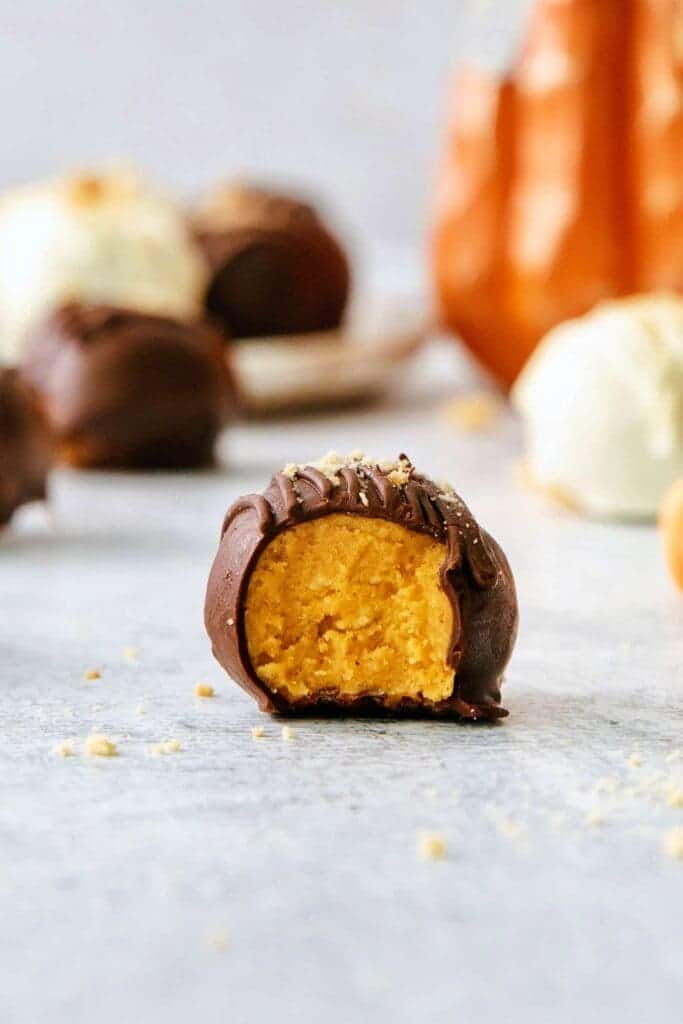 A view of a bitten pumpkin spice truffles