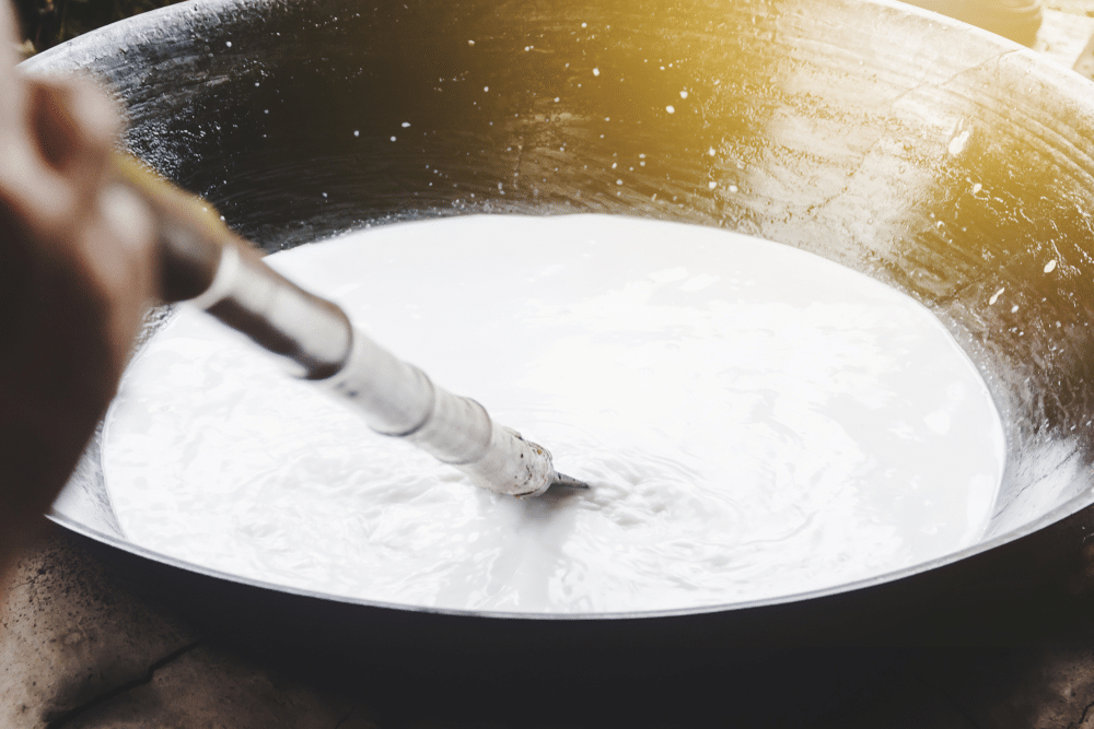 A view of coconut milk being stirred