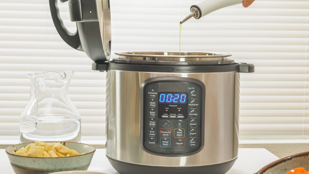 A view of oil being poured inside a crockpot