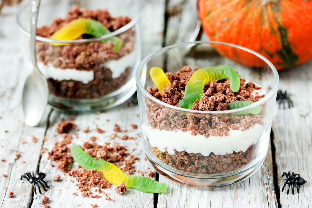 A view of oreo dessert cups with gummy worms