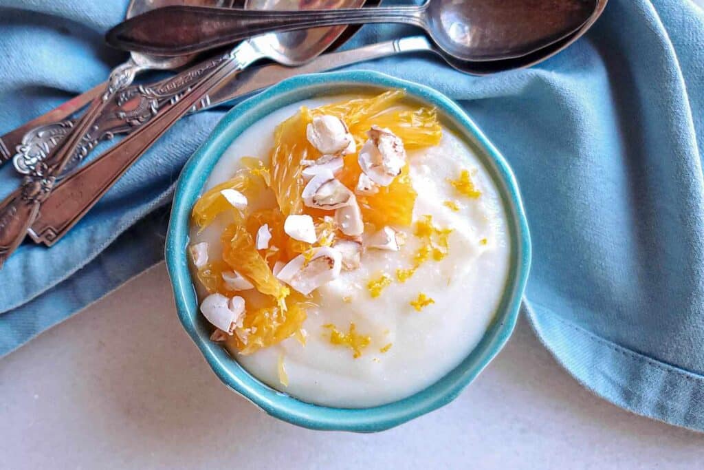 An overhead view of orange almont rice pudding gluten free in a bowl