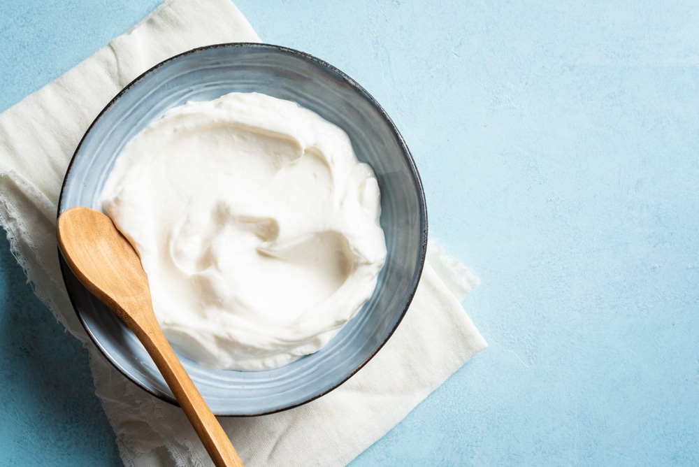 An overhead view of cream cheese inside a bowl