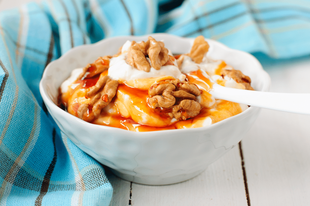 Greek Yoghurt with Honey and Walnuts in a Bowl