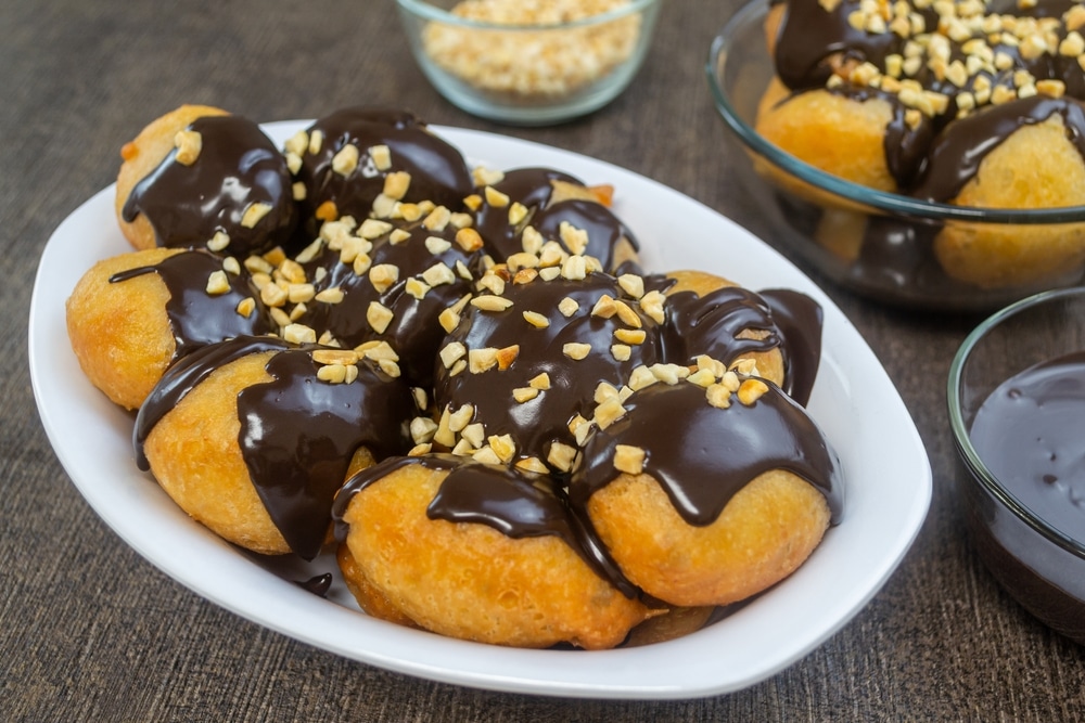 Loukoumades topped With Melted Chocolate and nuts