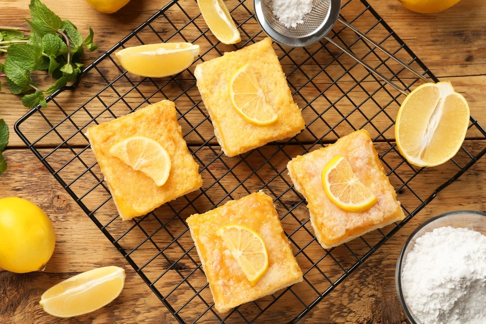 Tasty Lemon Bars On Wooden Table Flat Lay