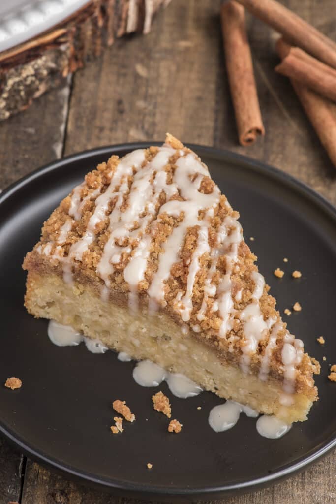 a slice of Classic Bisquick Coffee Cake in a black plate