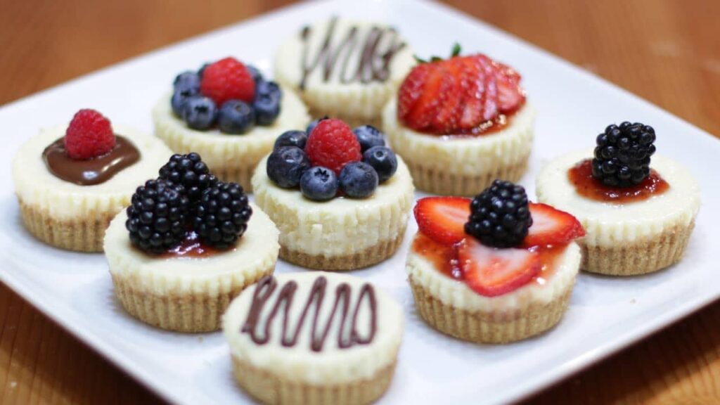 different cheese cake bites topped with different fruits