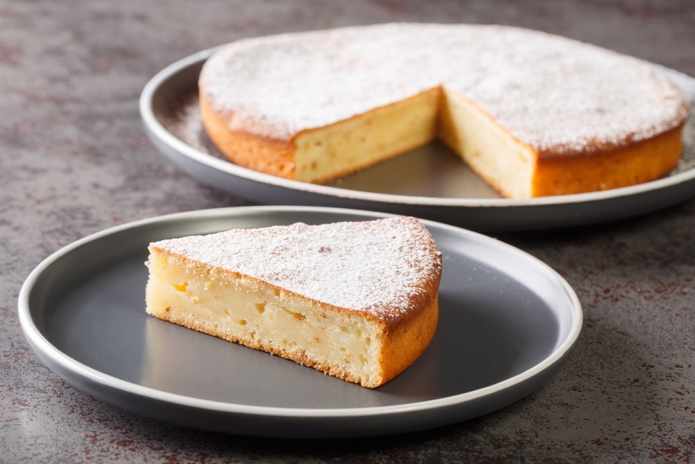 piece of traditional Greek yogurt cake Yaourtopita in a plate on the table