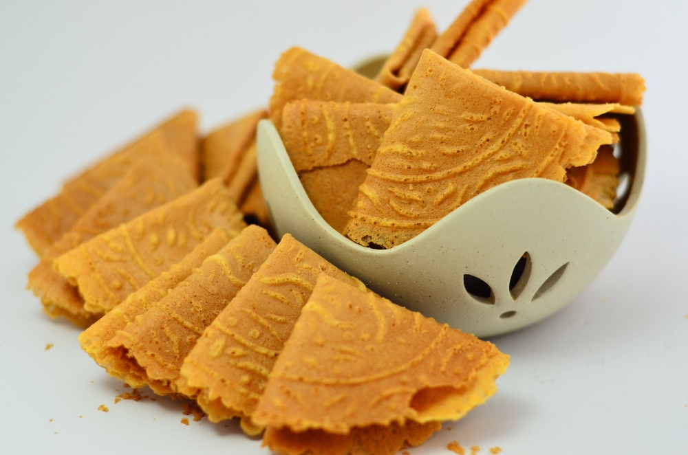 Crispy Traditional Kuih Kapit In A Bowl Isolated On A