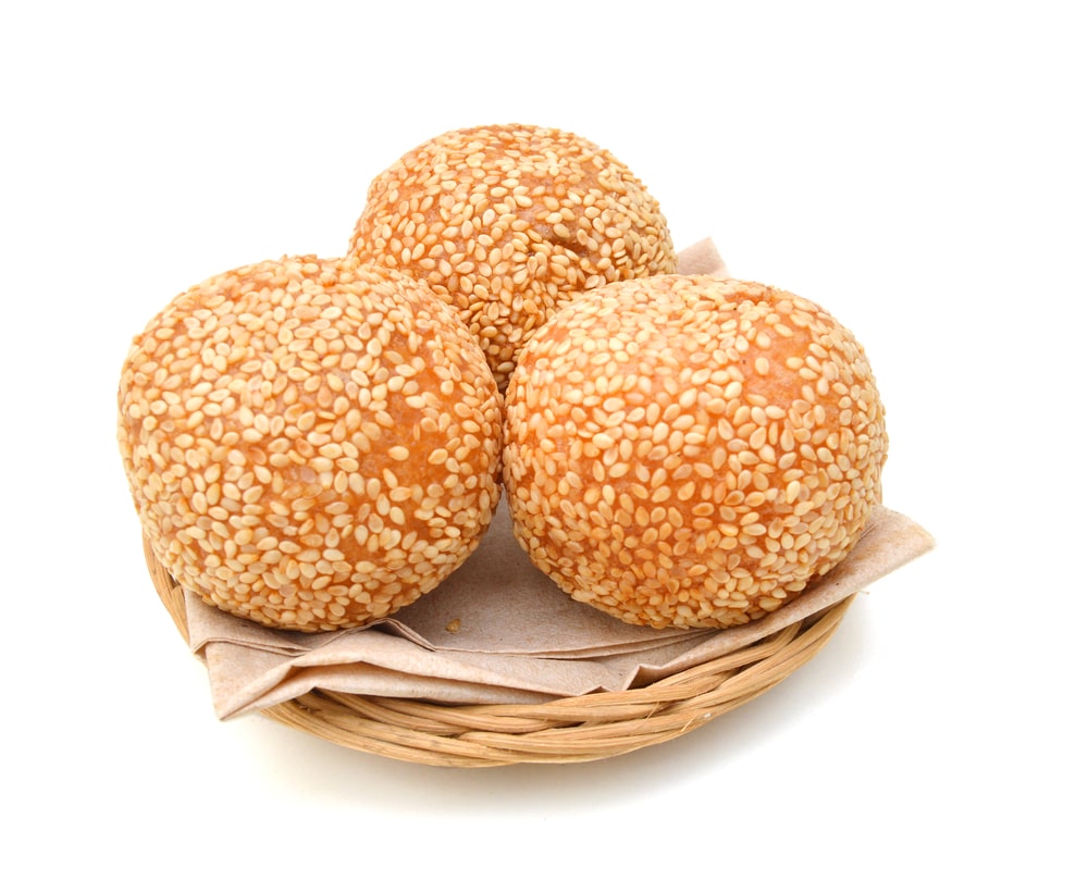 Traditional Asian Dessert Sesame Ball In Basket On White Background