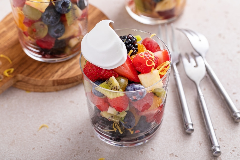 Fruit Salad With Berries Citrus Zest Mint And Honey Dressing